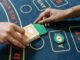 Blackjack Live RIKVIP: Mastering Real-Time Strategy and Table Tactics A modern live casino studio setup featuring a professional dealer hosting a blackjack table.